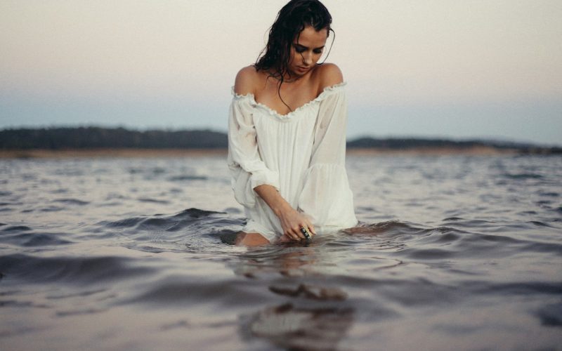 woman posing in body of water